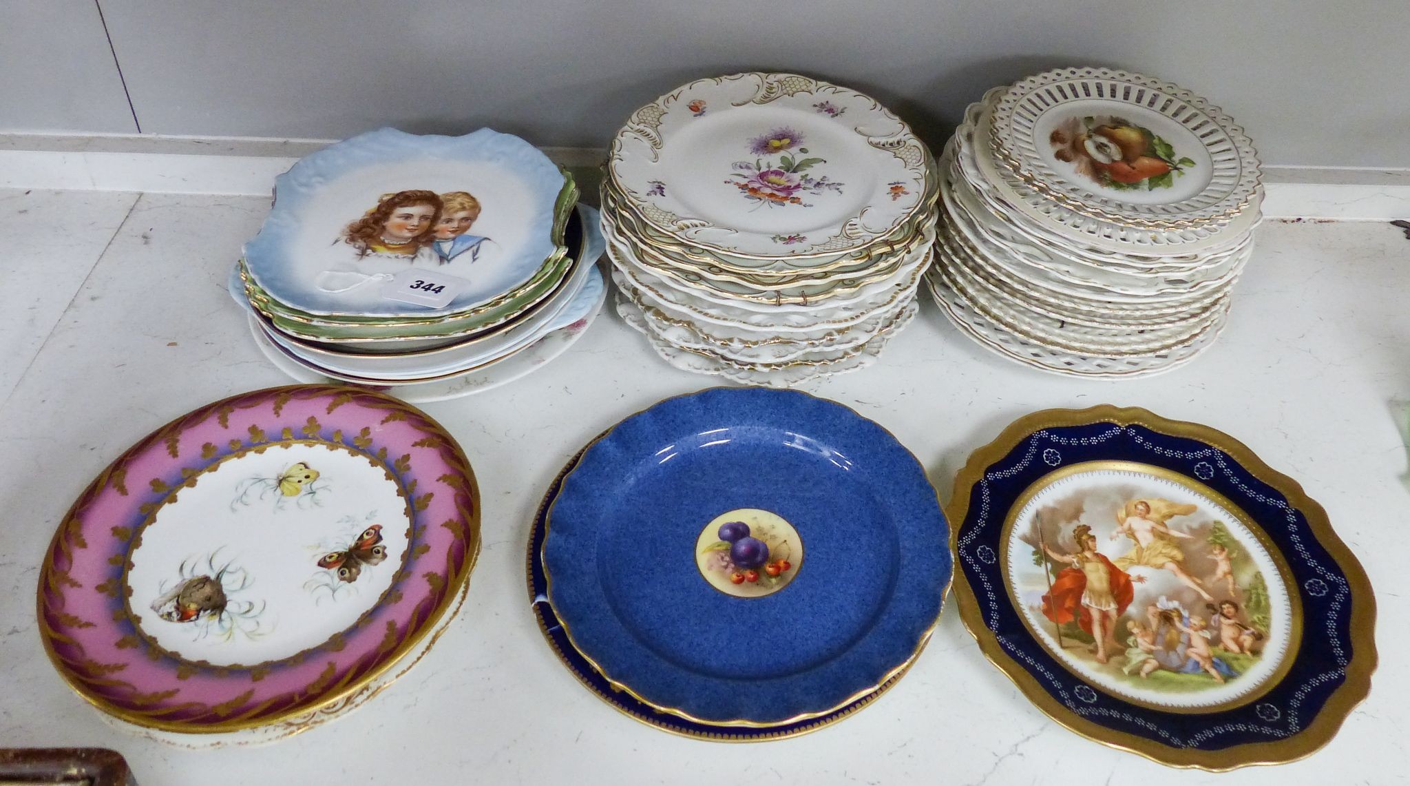 A collection of 19th/20th century Continental porcelain wall plates including a Royal Worcester powder blue fruit painted plate signed W. Bee, 23cm